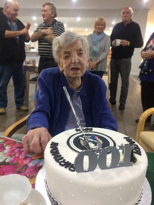MILESTONE CELEBRATION: Former Stawell resident Ann McInnes celebrates her centenary birthday with a Collingwood-themed cake. Picture: CONTRIBUTED