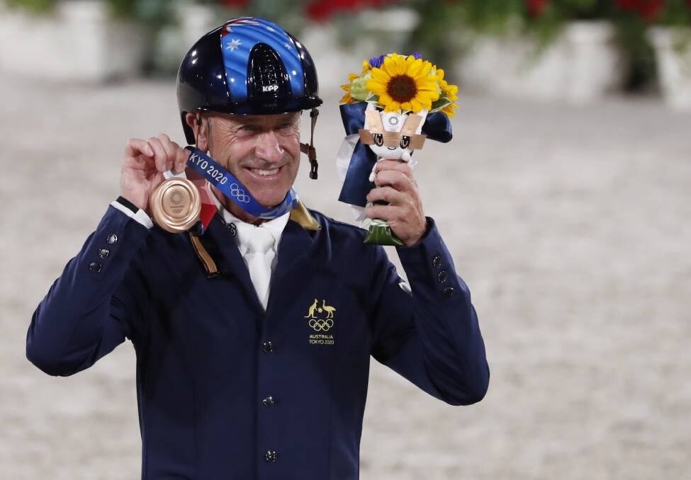 SUBLIME: Culcairn's Andrew Hoy celebrates individual bronze at the Tokyo Olympics on Monday, a matter of hours after Australia won team eventing silver. Picture: EPA