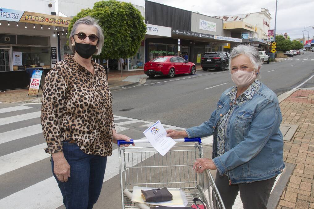 Shop for Stawell: Stawell Regional Health Y-Zetts' Helene Nicholson (left) and Meg Blake want residents to shop local this Christmas. Picture: PETER PICKERING