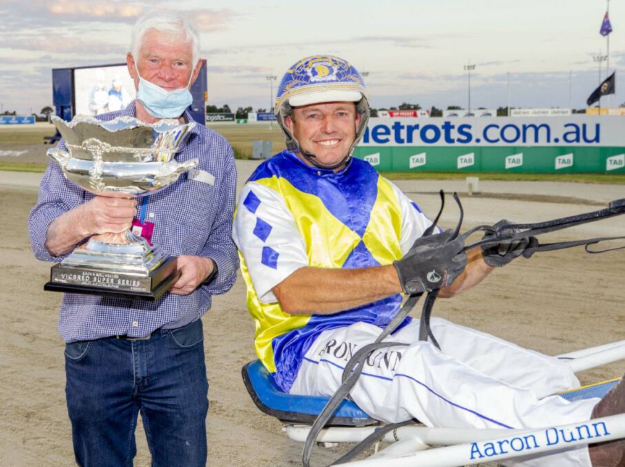 WINNER: Horsham owner-trainer-driver Aaron Dunn (right) won the Victorian-bred three-year-old colts and geldings series final. Picture: STUART McCORMICK