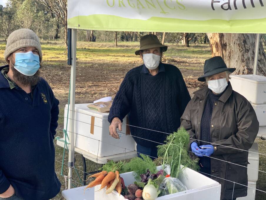 Popular pack: Bellellen Grampians Organics lost 90 of its market due to the COVID-19 pandemic, but locally sold Farm Gate Boxes have made up for the downfall. From left: Hadyn Black, Rod Blake and Meg Blake. Picture: BEN FRASER