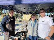 DEDICATED: Concongella Primary School parents run a sausage sizzle and bake sale to raise fund for the school. Picture: BEN FRASER