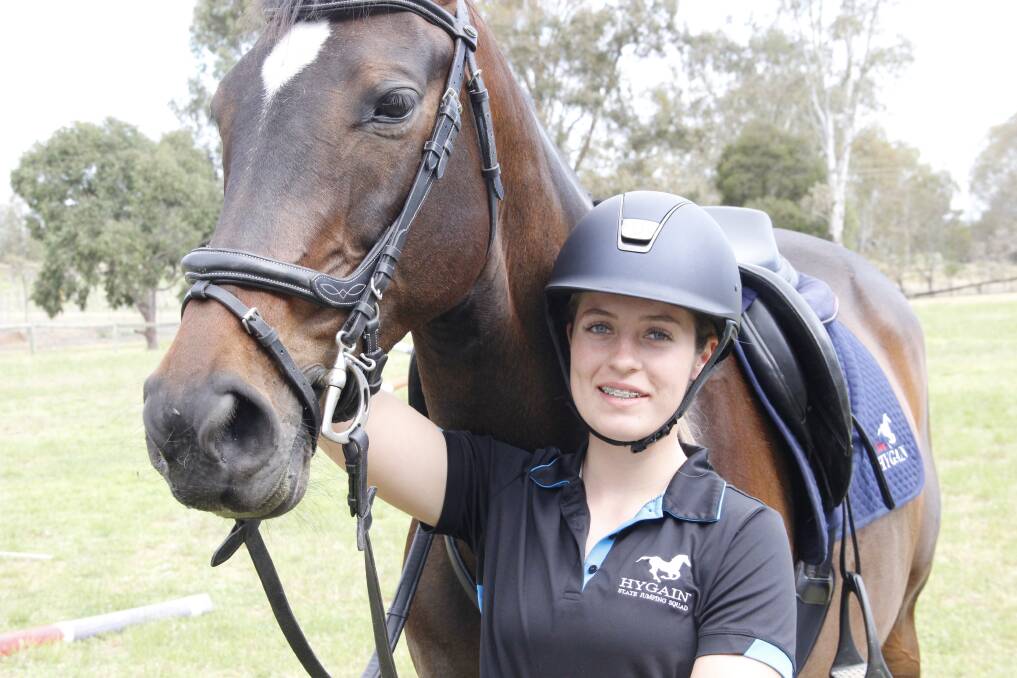 FLYING HIGH: Hannah Wigg and her
 horse Lily will participate in the Australian 
Show Jumping Championships. 
Pictures: LACHLAN WILLIAMS