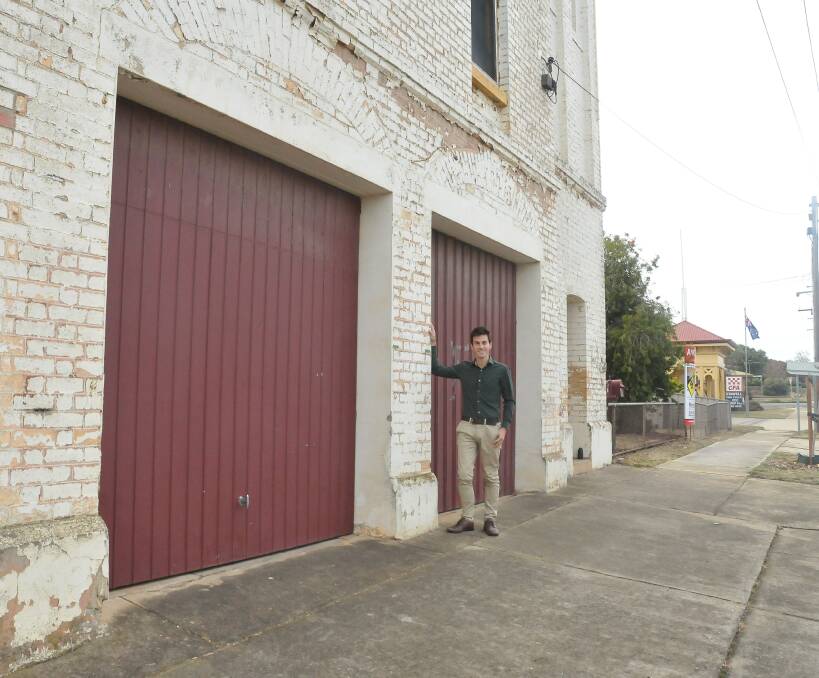 SOLD: Dr Tyler Humphris in front of the old fire station building. Dr Humphris purchased the building at auction on Saturday. Picture: CASSANDRA LANGLEY