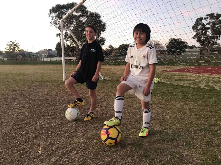 BREAKING DOWN BARRIERS: Darcy and Rhianne are two of a handful or girls who play for Stawell Soccer Club. Picture: CASSANDRA LANGLEY