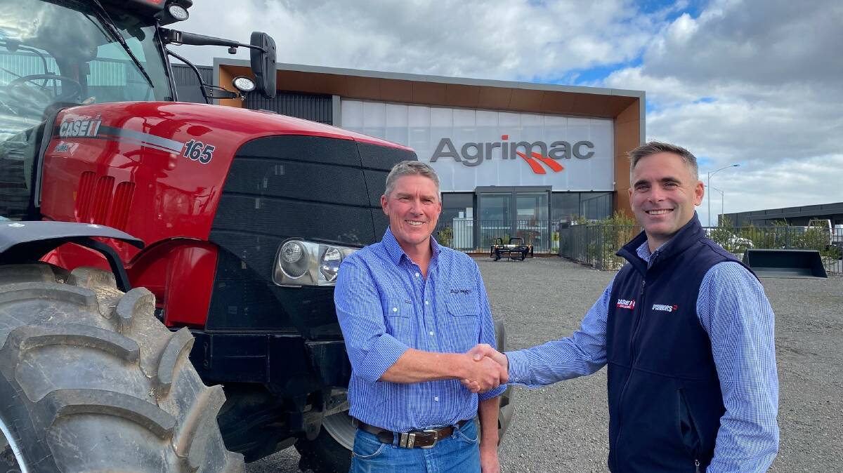 PURCHASE: Agrimac dealer principal Hugh McEachern with O'Connors chief executive officer Gareth Webb. Picture: CONTRIBUTED