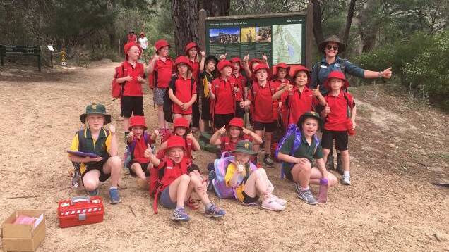 LEARNING: Park Ranger Hannah Auld getting students from Moyston and Pomonal primary schools involved in ClimateWatch in the Grampians National Park. Picture: CONTRIBUTED
