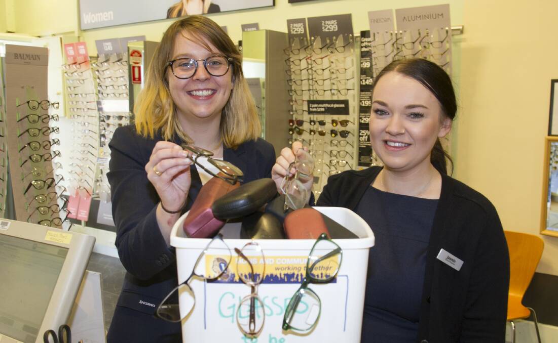 GREAT VISION: Specsavers Annie-Jo Ross and Jasmine Cameron with some donated glasses. Pictures: PETER PICKERING