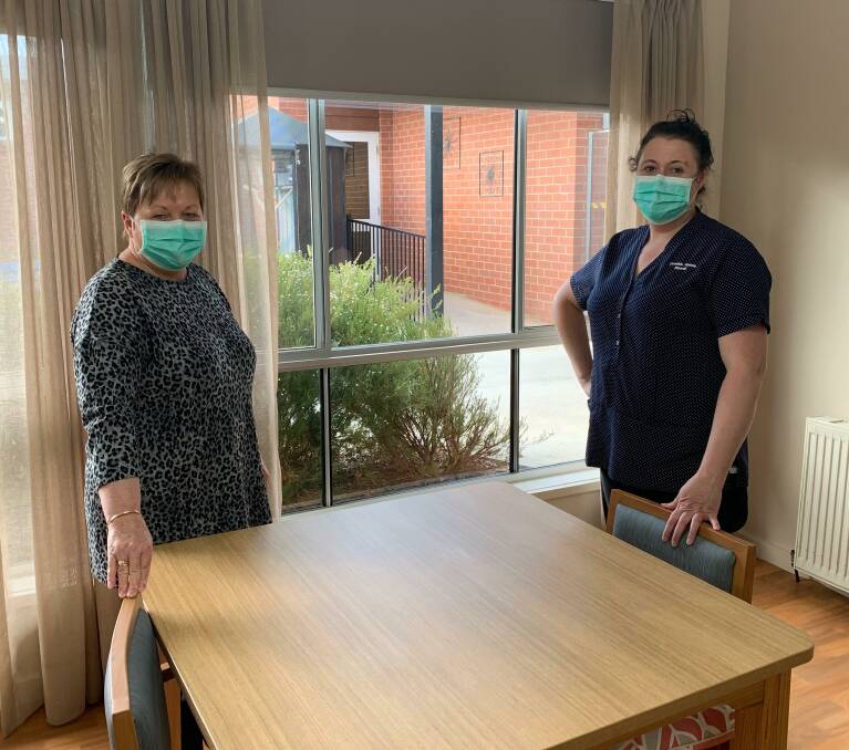 WORKING HARD: Eventide Homes chief executive Sue Blakey and personal care worker Tanya O'Neill talk through the recent changes.