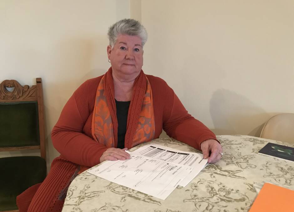 STILL WAITING: Yvonne Dowie keeps a record of every phone call and conversation she has had trying to find her refund. Picture: CASSANDRA LANGLEY
