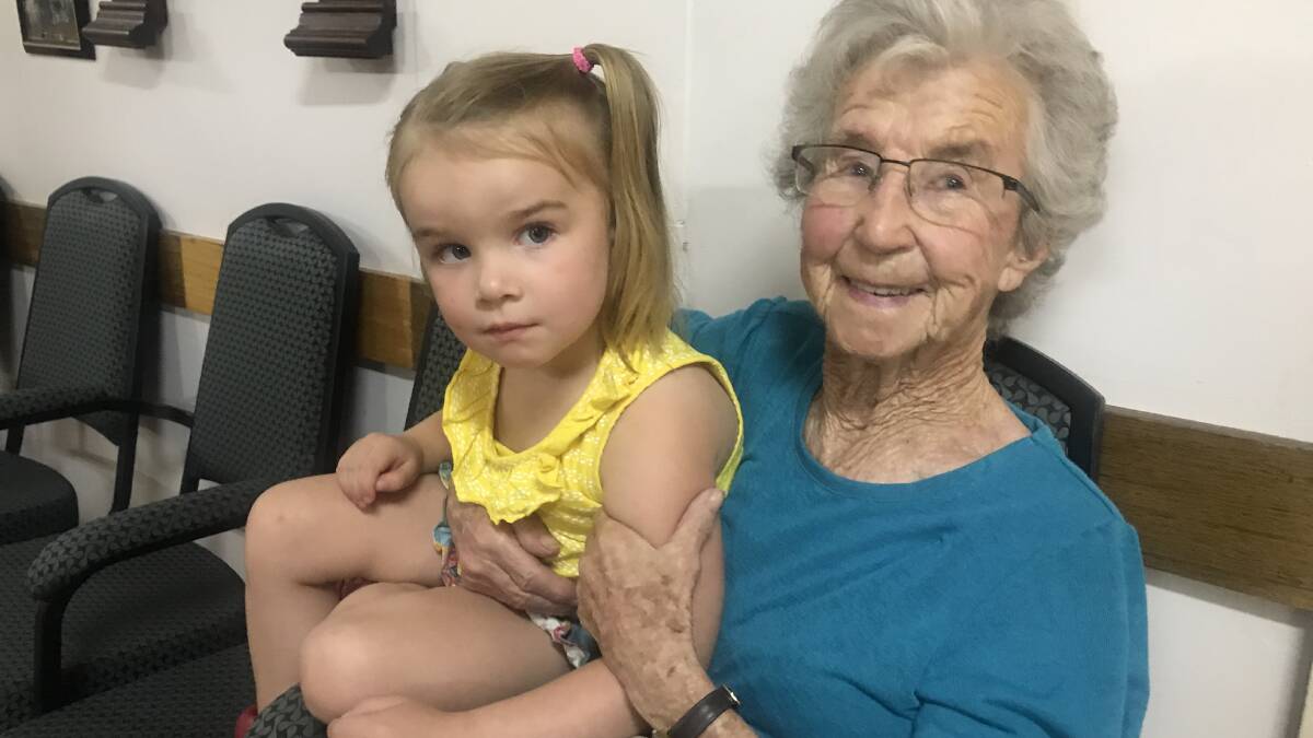 EVERYONE'S WELCOME: Juno with her great grandma Betty Kingston were happily watching on. 