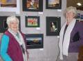 ART: Margo Sietsma and Ruth Hatton enjoy a previous exhibition. Picture: CONTRIBUTED