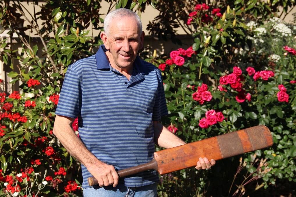 HEIRLOOM: Ray Robinson with his beloved cricket bat, which has been in his family since 1905. Picture: LACHLAN WILLIAMS