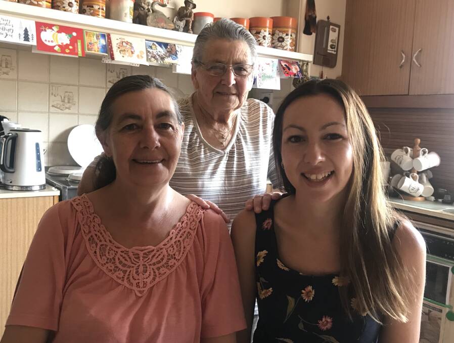 THREE GENERATIONS: Julie Cass, Ruby Webb and Jessica Cass share the duties of Christmas day preparations. Picture: CASSANDRA LANGLEY
