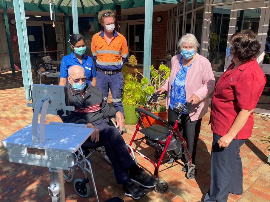 TESTING NEW TECHNOLOGY: MacPherson Smith staff and residents with Stawell Gold Mines' environment and community superintendent Cameron Hope trying the new workstations. Picture: CONTRIBUTED