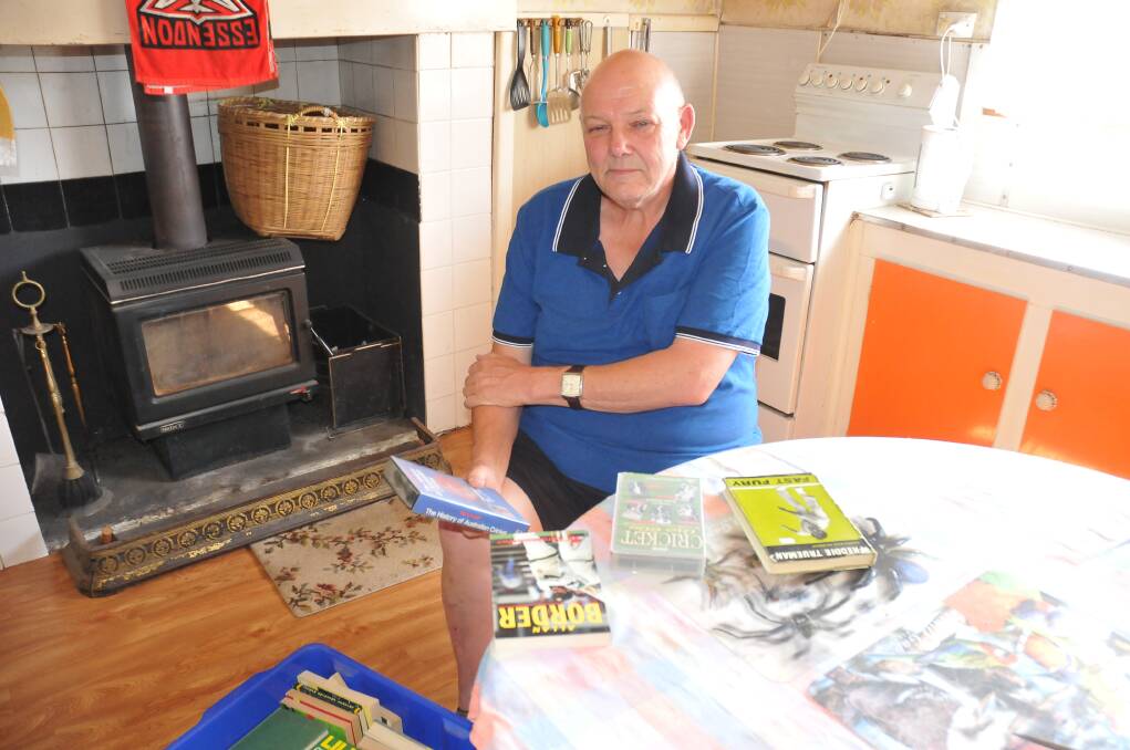 MOVING ON: Duncan Hey packed up his house this week, including his memorabilia, as he moves to Maryborough. Picture: CASSANDRA LANGLEY