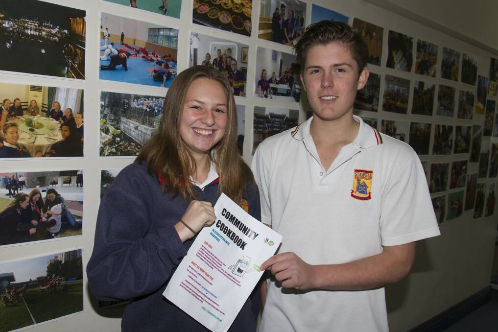 Jasmin and Charlie together with other students are producing a community cookbook. Picture: PETER PICKERING