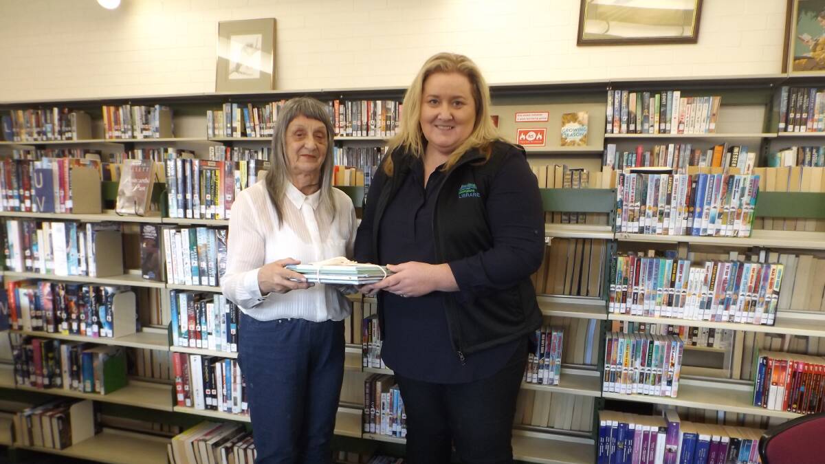 DONATION: Stawell U3a president Gabrielle Chamberlin and Stawell Library librarian Kerry Wilson with the donated books. Picture: CONTRIBUTED