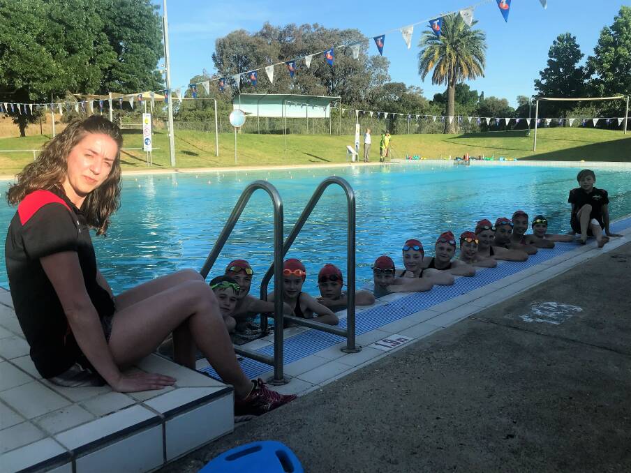 IN THE WATER: Natalie Martin with the members of the Stawell Stingrays Swimming Club. Picture: CASSANDRA LANGLEY