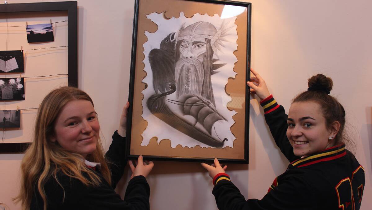 ARTWORK: Holly Crouch and Maeve Rickard displaying artwork for the exhibition.