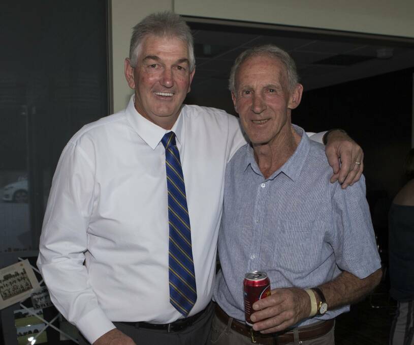 A LOOK BACK: Peter Homden and Roger Edwards re-living past Grampians Cricket Association glory days at a reunion.