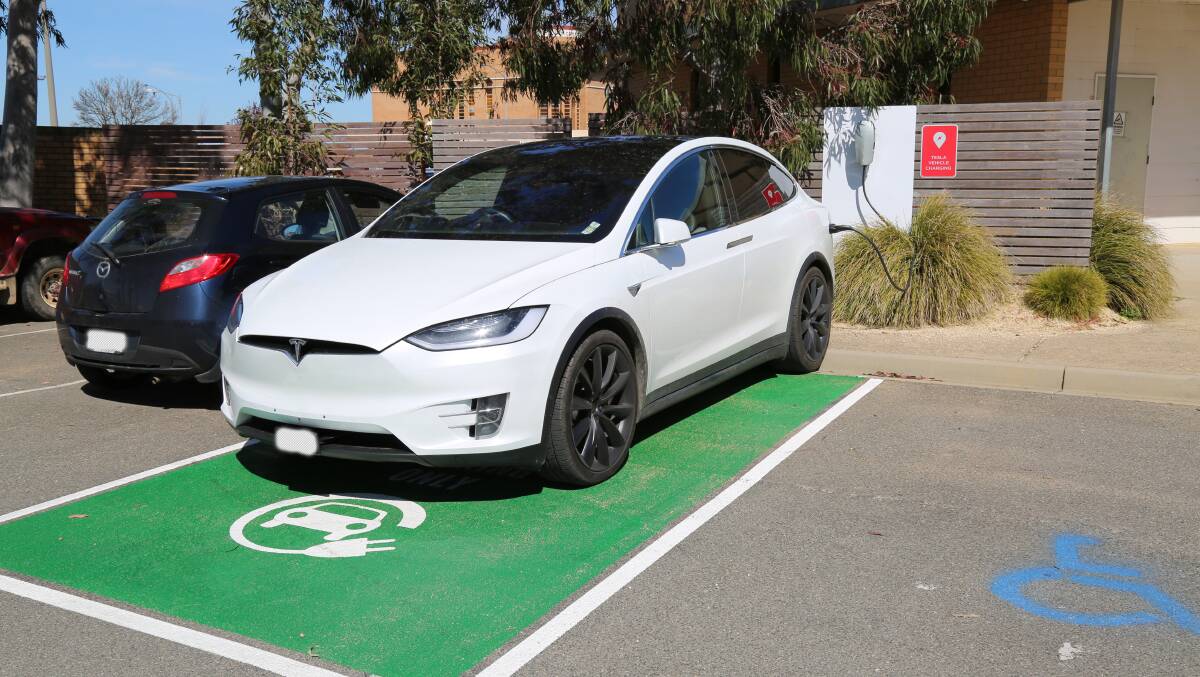 CHARGING: A Tesla at the new electric car charger located in the car park next to the
Ararat Regional Library. Picture: CONTRIBUTED