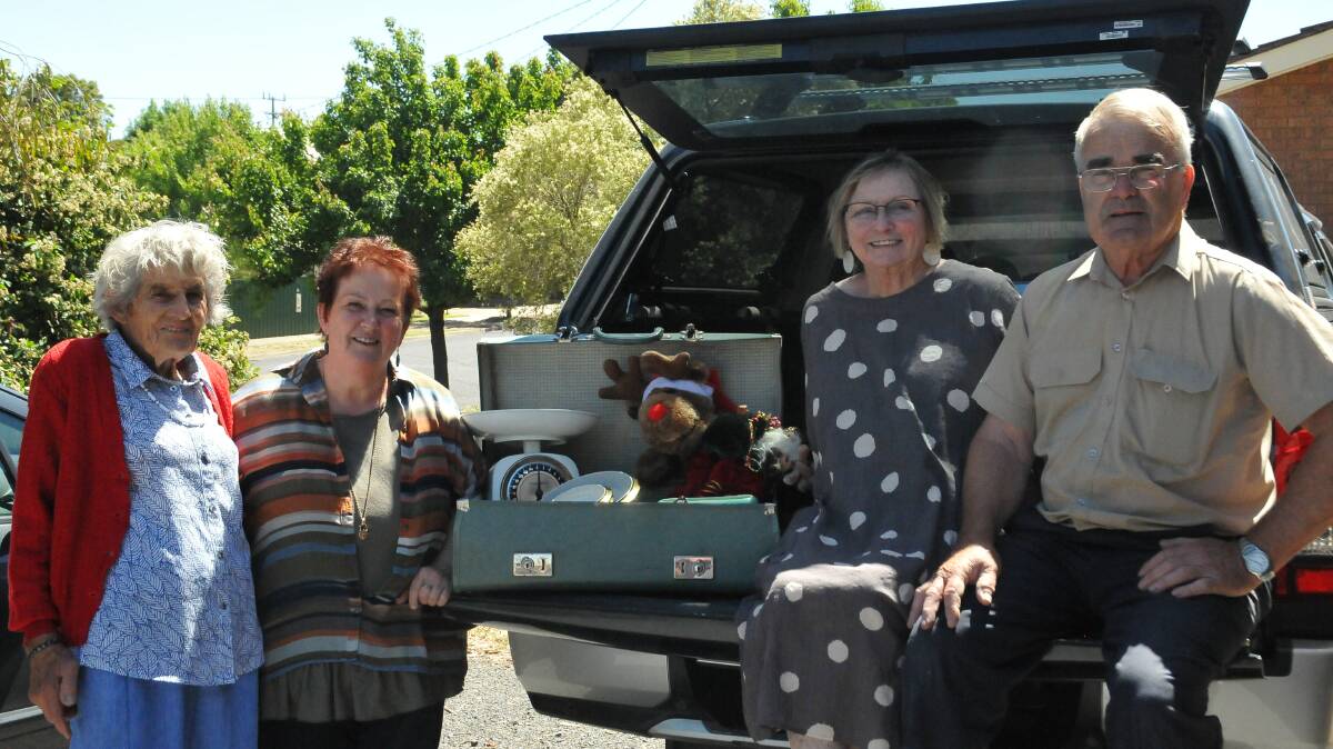 GETTING READY: Elva Ragget, Alison Rasche, Kay Evans and Peter Evans are setting up for the car boot sale at Stawell Uniting Church on Saturday. Picture: CASSANDRA LANGLEY