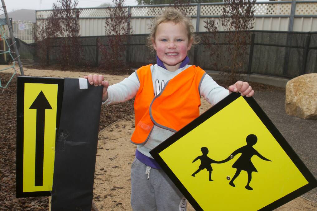 DIRECTING TRAFFIC: A safety-conscious Lela is having fun while learning all about road safety. Picture: PETER PICKERING