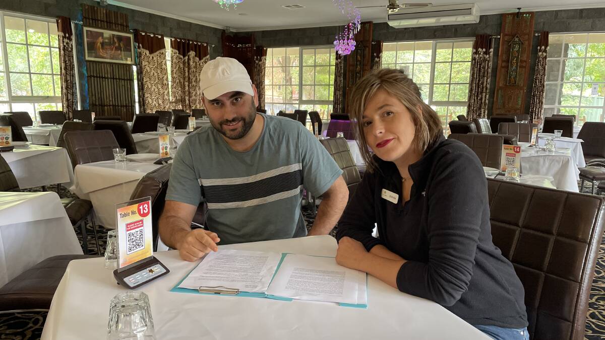 SOLUTIONS: Spirit of Punjab owner Gary Singh with Lakeside Tourist Park owner Josephina McDonald work through options to attract workers to the region. Picture: CASSANDRA LANGLEY