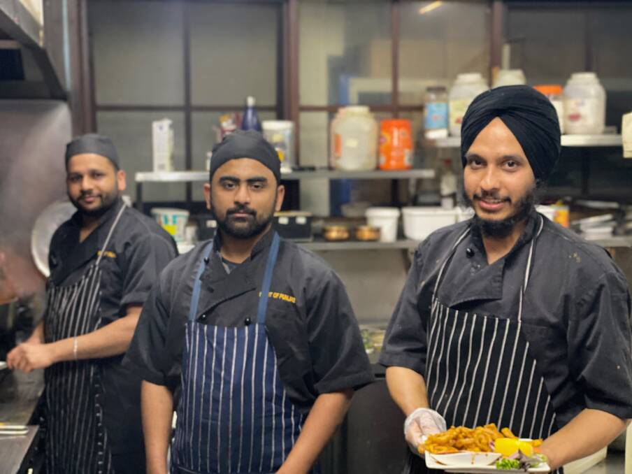 FOR A CAUSE: Spirit of Punjab cooks Kamalpreet Singh, Navjot Sharna and Amrinder Singh are ready to help Australian farmers on Sunday. Picture: CONTRIBUTED