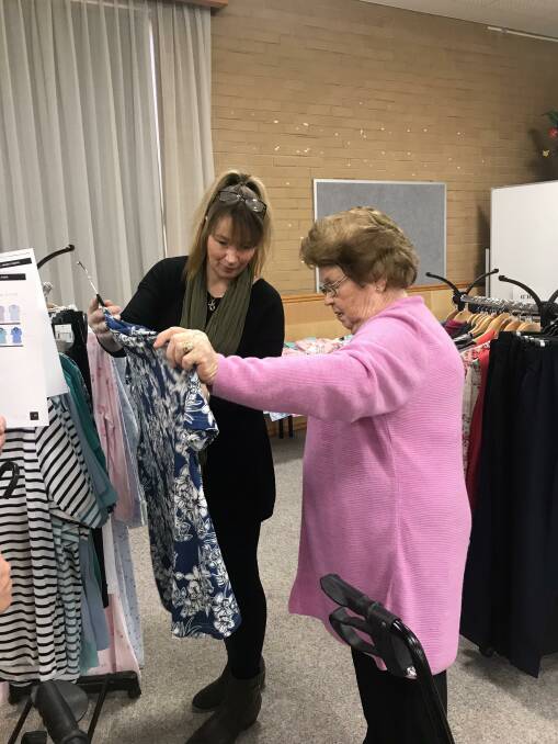 SELECTION: Sneek-a-Peek owner Adrienne Preston with Eventide Homes resident Pat Robson looking through the range of clothing. Picture: CONTRIBUTED