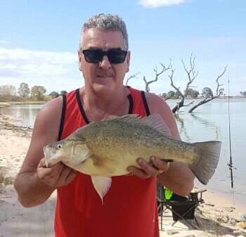 SUCCESS: Mark McGee with his winning yellowbelly fish.