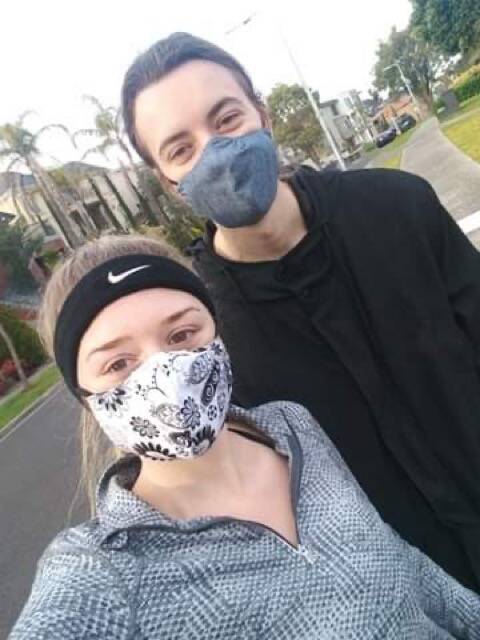 FAMILY: Lois Johnson's family members Kristy and Jack wearing their masks on a walk in Melbourne.