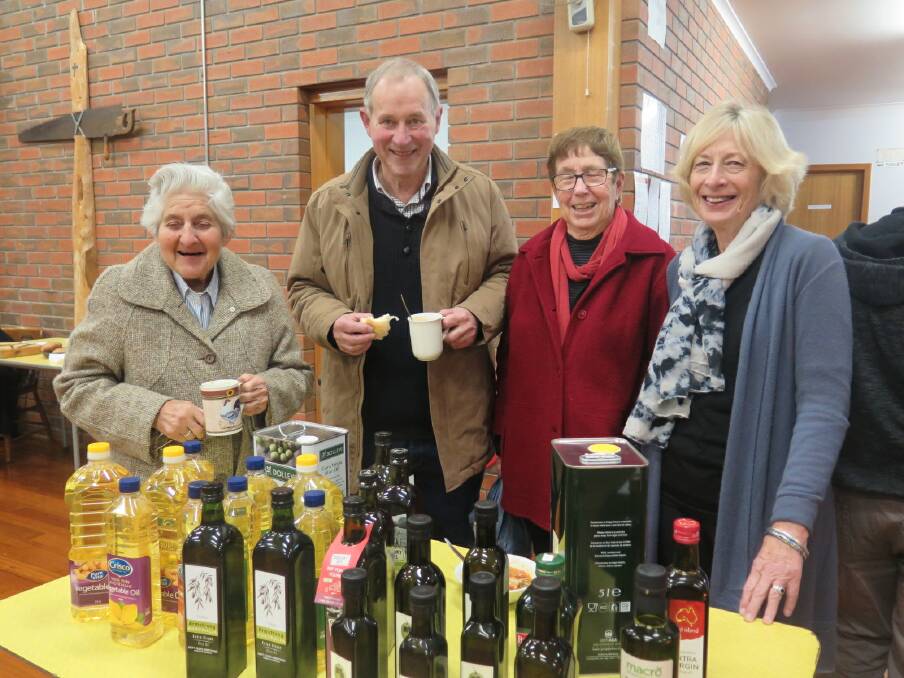 OIL: Sister John, Brendan Holland, Cathy Holland, Helen Francis with oil donated to refugees. Picture: CONTRIBUTED