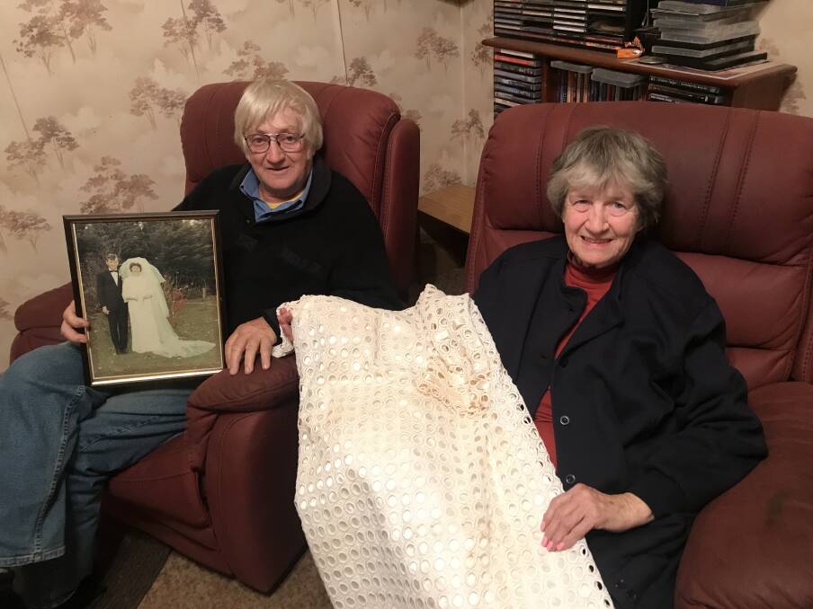 LOOKING BACK: Landsborough's Bernard and Wilma Browne with Mrs Browne's wedding dress from their wedding day, 50 years ago. Picture: CASSANDRA LANGLEY