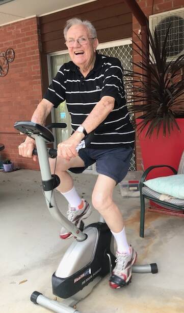 CHEERFUL: Eventide Homes resident Harold Blake will still ride his exercise bike every day to keep fit and health. Picture: CONTRIBUTED