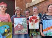 GETTING READY: Bev Buckley, Jane Delley, Kylie Walsh, Judy McPhee and Karran Neville show off show of the artwork that will be on display. Picture: CASSANDRA LANGLEY