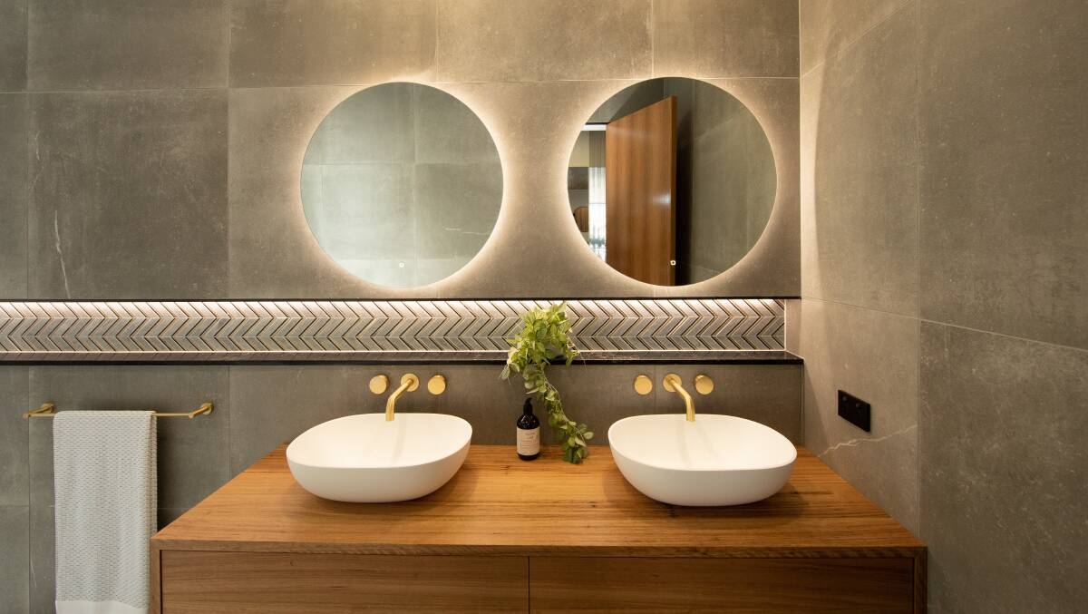 Budget hacks: You can still give your guests a memorable bathroom experience by lodging a luxe LED mirror above your vanity. Photo: Highgrove