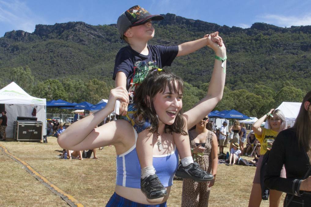 FAMILY FRIENDLY: Evie Wallace gives Oscar a better view to dance along with the music at the Grampians Music Festival in 2019. Picture: PETER PICKERING