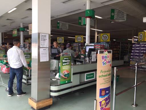 BLACK OUT: Customers shop in the dark at Horsham Woolworths after a power outage hit the store. Picture: ELIZA BERLAGE