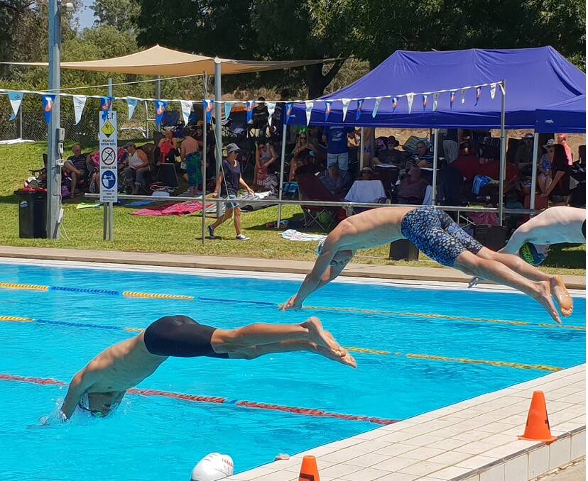 DIVE: A group of swimmers from Ararat dive into a race from the Stawell swim meet. Picture: CONTRIBUTED 