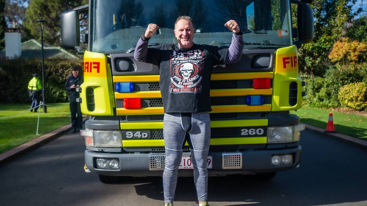 Grant Edwards attempted to pull a 10-tonne fire engine 50 metres to raise awareness for PTSD. Picture: Karleen Minney