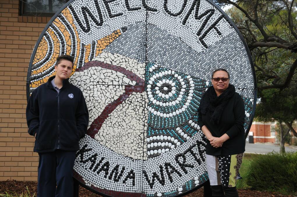 Yasmin Harradine and Nola Illin with the Dimboola Memorial Secondary School Welcome Mosaic. The school has been nominated for the Active Schools Award for the mosaic.