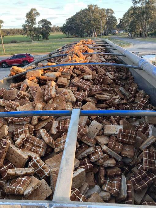 St Arnaud transport company Hendy Transport enlisted the help of St Arnaud Football Club to unpack 16 tonnes of hot cross buns. Picture: CONTRIBUED