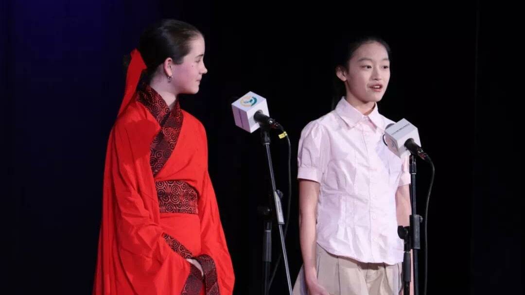 NI HAO: Jade Oates gives a speech with her Chinese speaking partner at the 10th Global Village Chinese Speaking Competition. Picture: SUPPLIED.