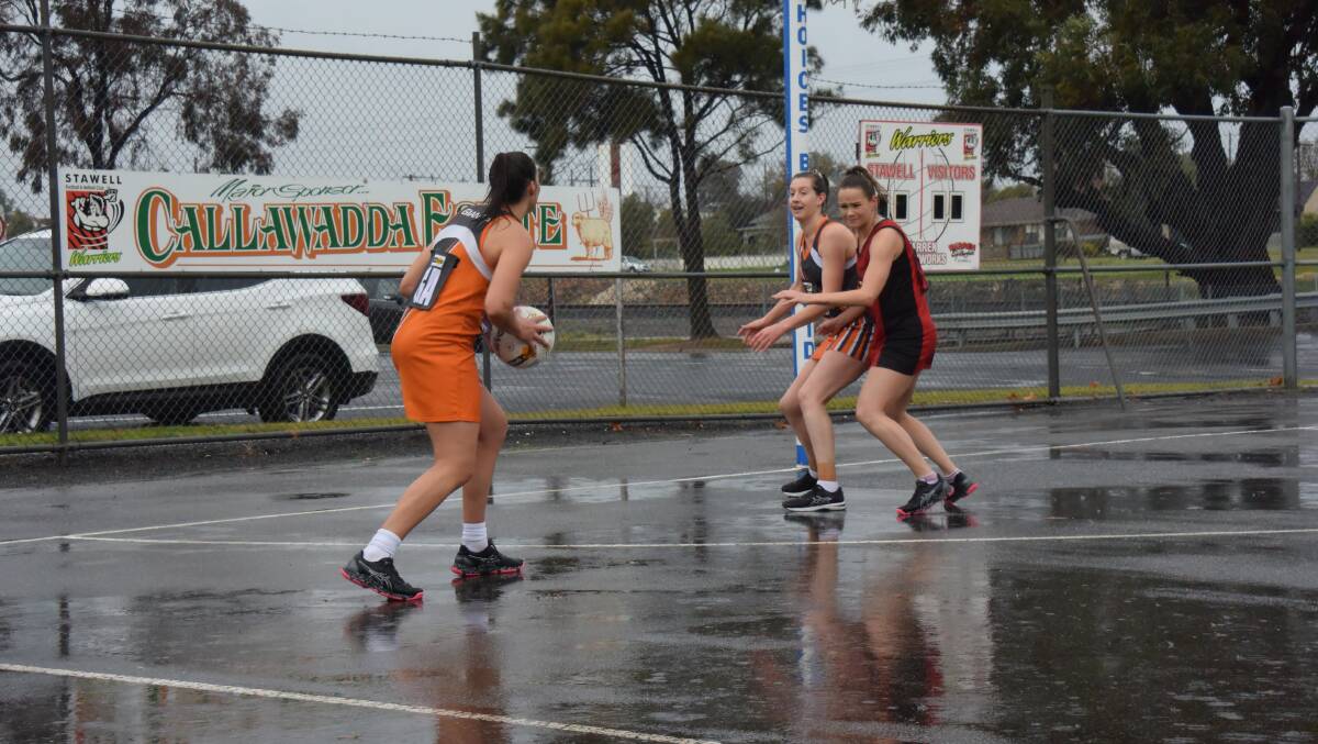 A lone Warrior tries to block Southern Mallee Giants players.