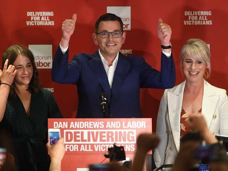  Daniel Andrews, with his daughter and wife, claims victory in the Victorian election.