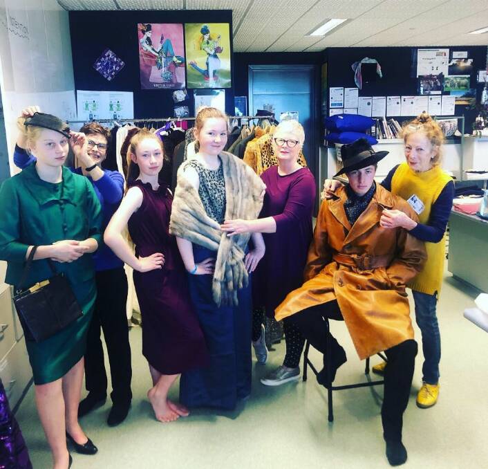 IN STYLE: U3A members help Marian College students prepare to model vintage fashions. Pictured L-R is Nicole Watts,Pam Orr, Lia Haywood, Tara Hendy, Deb Cooper, Nathan Vincent and Anne Hedgeland. Picture: CONTRIBUTED.