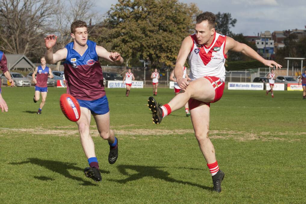 BOOT IT: Ararat senior footballer Ben Free releases the ball before the opposition can get to it. Picture: PETER PICKERING.