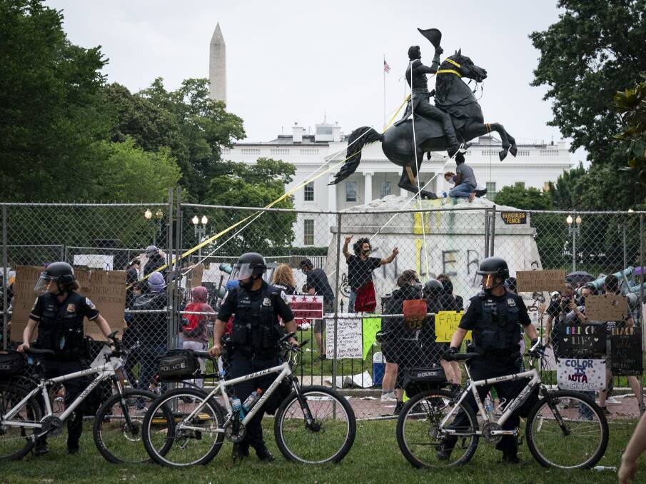 Protesters attempt to pull down the statue of Andrew Jackson in Lafayette Square near the White House on June 22, in Washington, DC. Photo: Drew Angerer/Getty Images